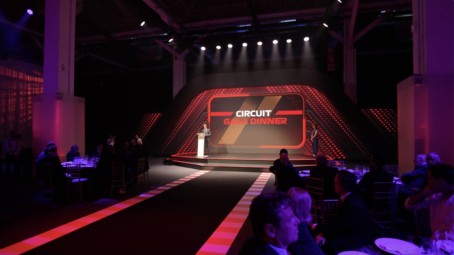 Speech on the Circuit Gala Dinner stage, guests at their tables